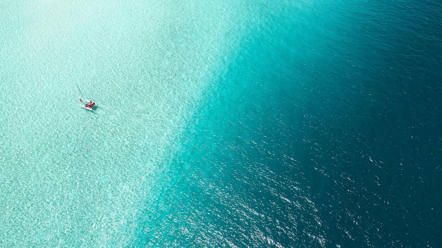 Kitesurfing over turquoise Zanzibar water